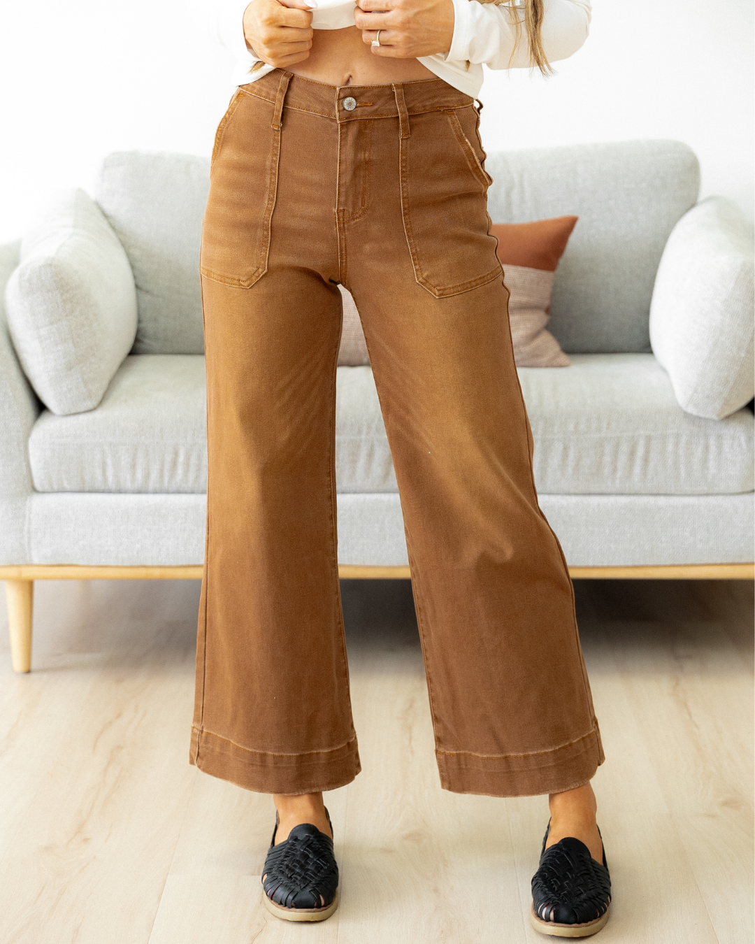 Front view of the Willow high-rise wide-leg cropped jeans in an earthy breen brown color, showcasing the classic pocket structure and relaxed leg fit.