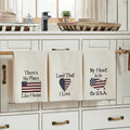 Set of three ivory tea towels with patriotic designs including a flag heart, USA map, and 'There's No Place Like Home' text