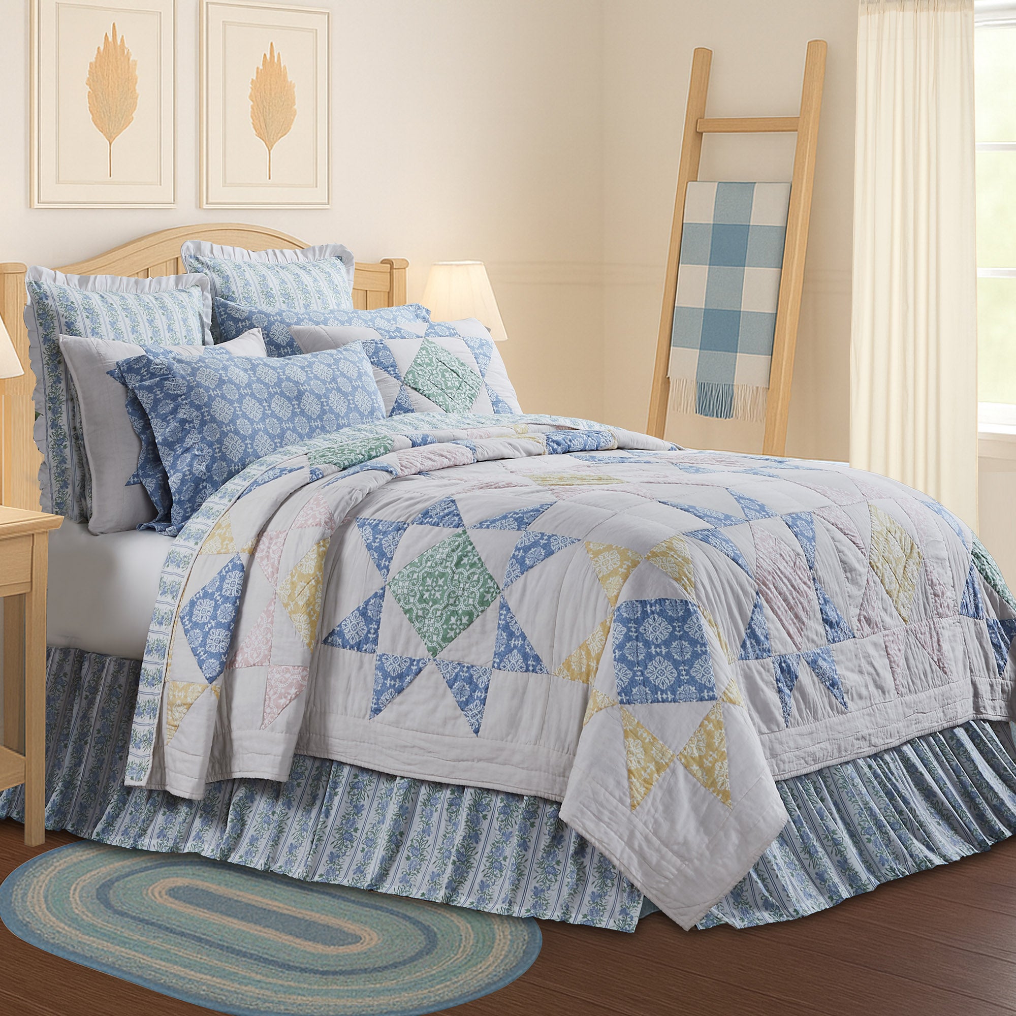 Jolie Blue Patchwork Bedding Set featuring a mix of blue and cream plaid and floral patterns on a cozy quilt with matching shams.