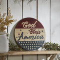 Round 11-inch patriotic welcome sign with stars and stripes in burgundy, navy, and cream with a distressed finish.