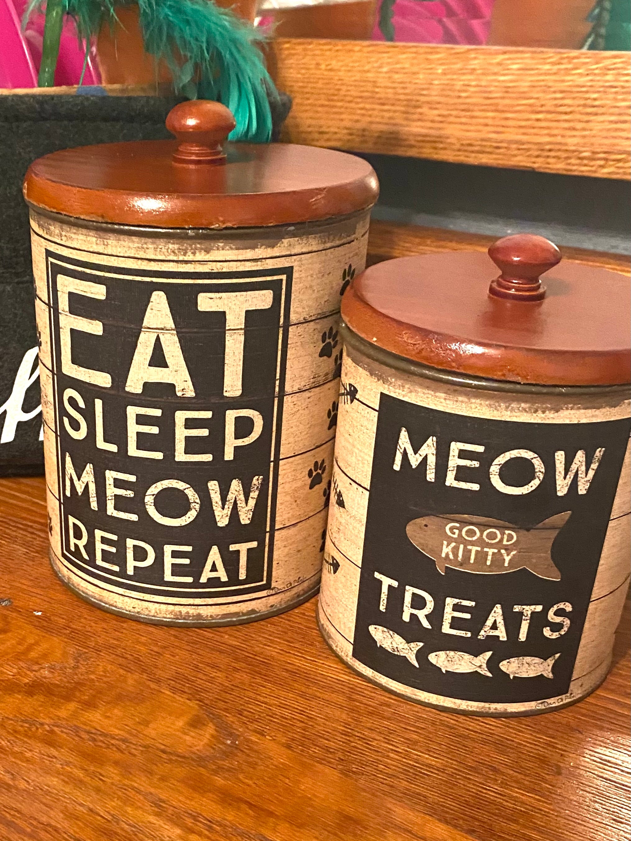 Rustic farmhouse cat treat canister set with Eat Sleep Meow Repeat and Meow Treats designs for pet food and treat storage.