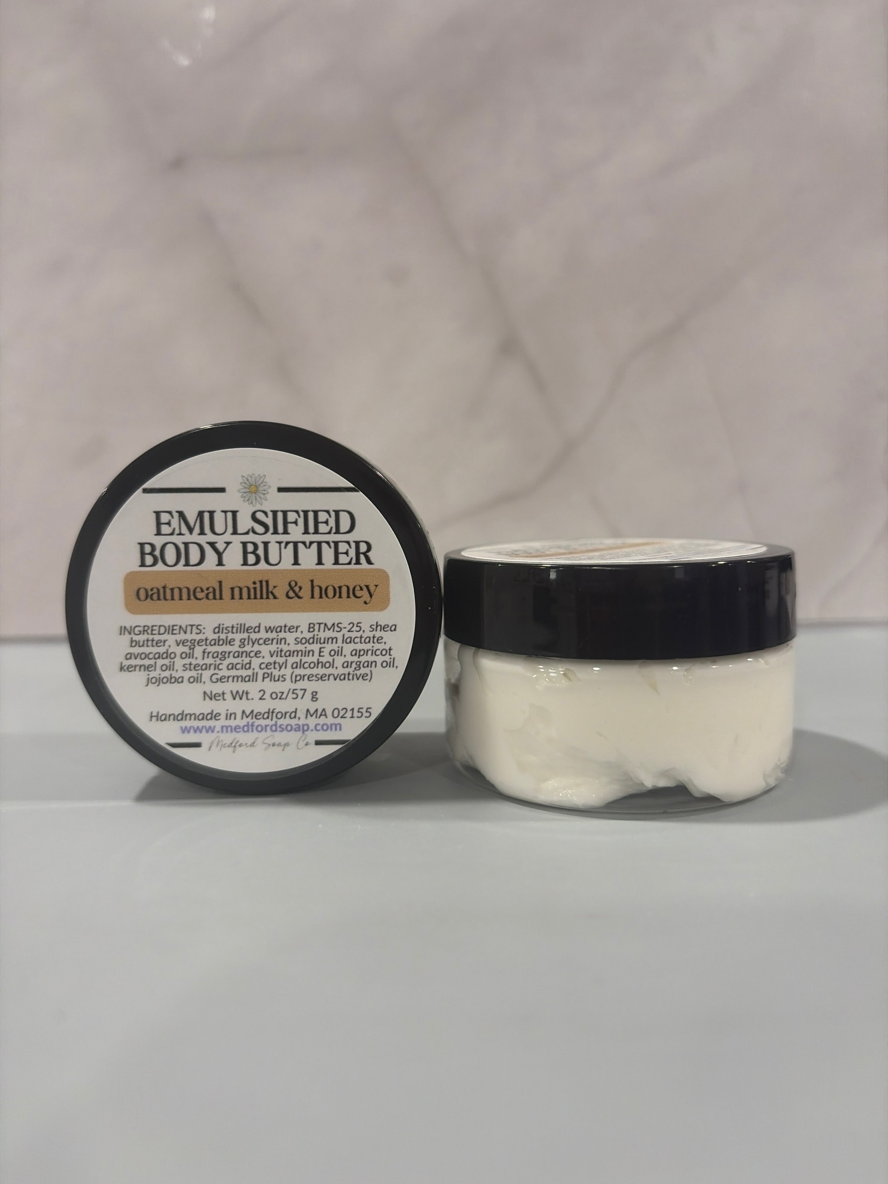 Close-up of a jar of whipped white emulsified body butter, showing a thick, luxurious, and creamy texture handmade by Medford Soap Co. for AllyBay.