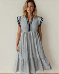 Front view of a black and white striped midi dress featuring romantic double ruffled short sleeves, a V-neckline, and subtle contrast trim accents.