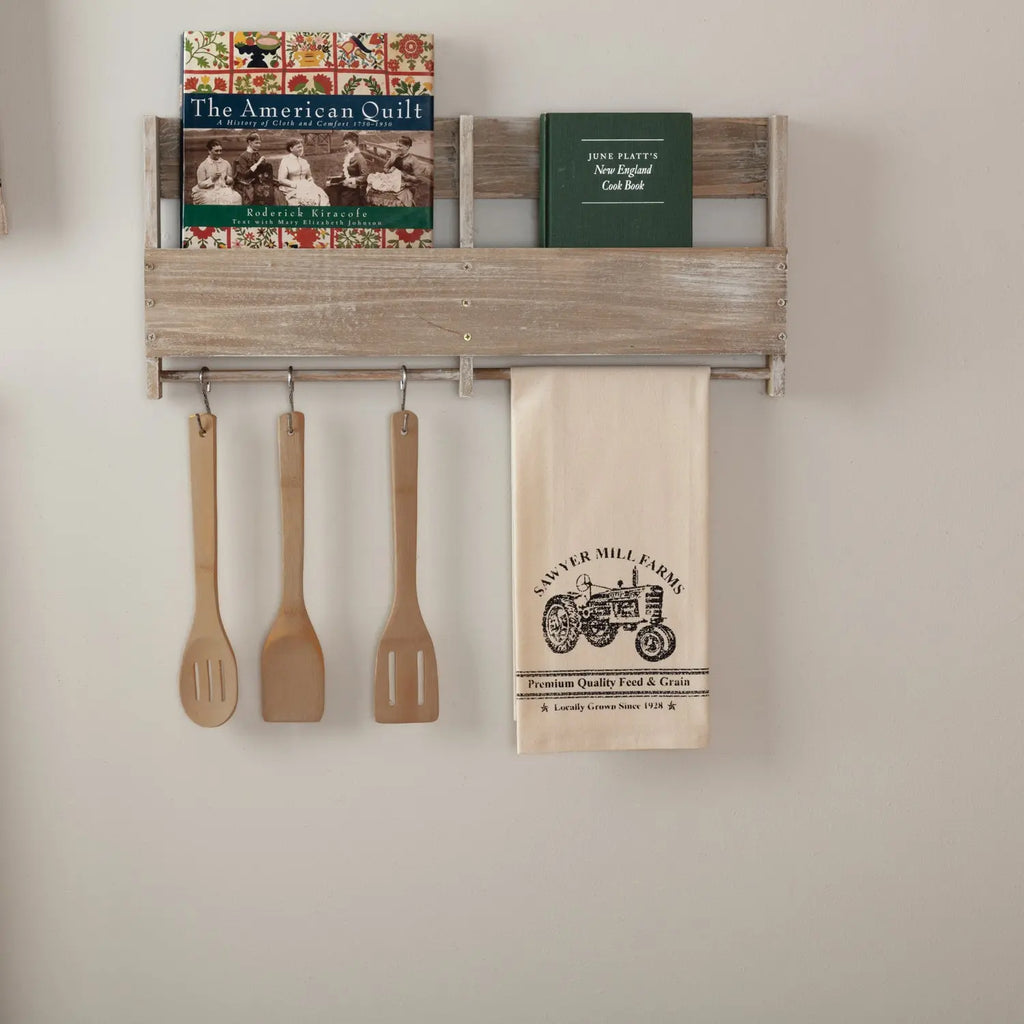 Antique cream cotton muslin tea towel featuring a black stenciled vintage tractor and 'Sawyer Mill Farms' branding.