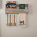 Antique cream cotton muslin tea towel featuring a black stenciled vintage tractor and 'Sawyer Mill Farms' branding.