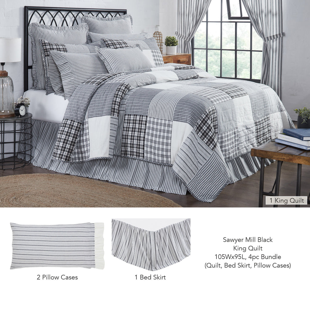 Sawyer Mill Charcoal bedding bundle featuring a 100% cotton patchwork quilt with gray, black, and cream plaids, stripes, and matching shams on a farmhouse-style bed.