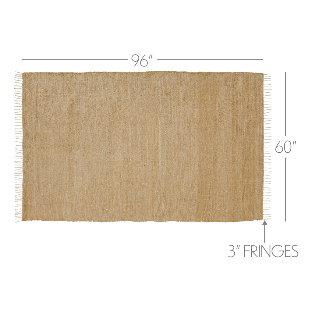 Detailed view of natural woven jute rug texture and fringe border.