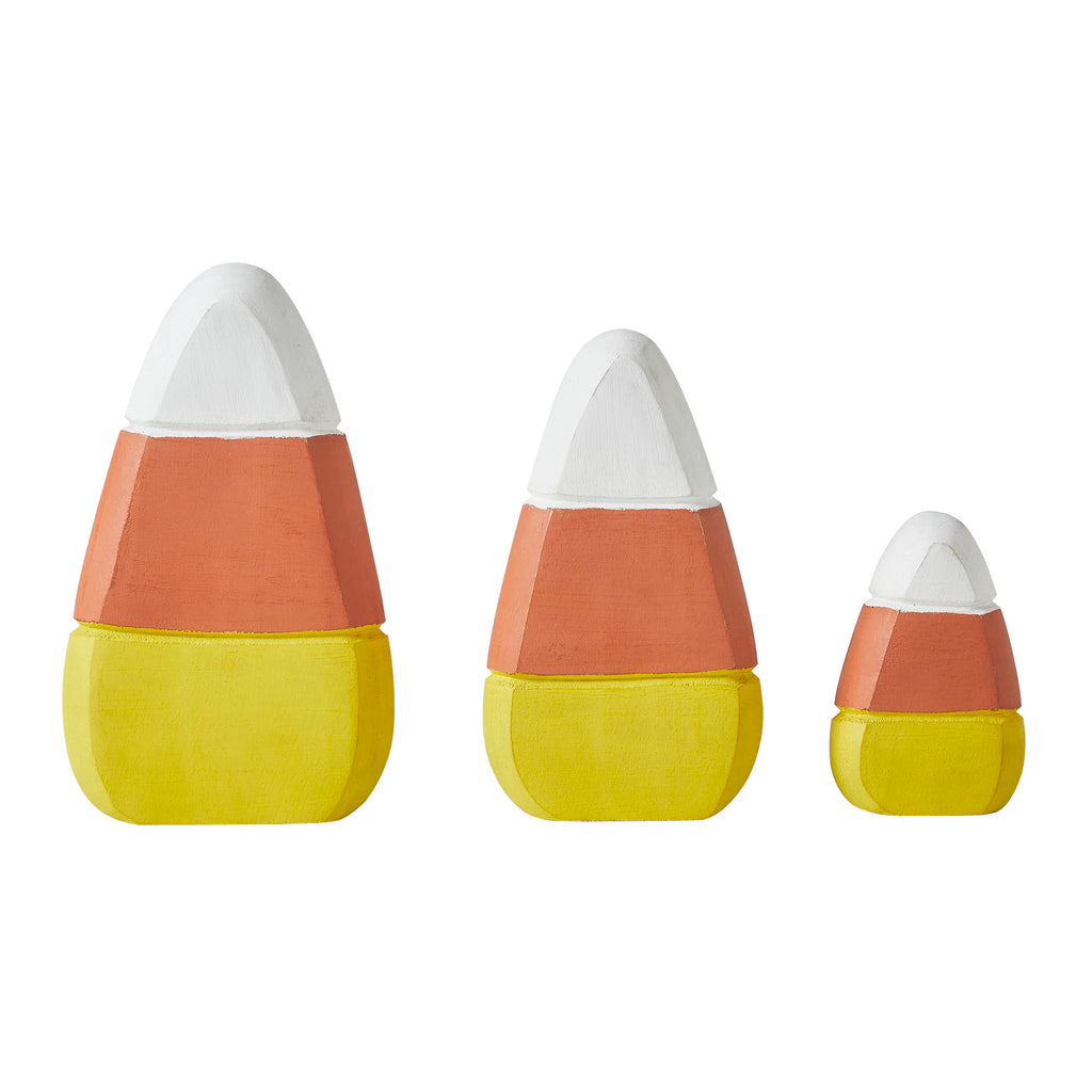 Side-by-side view showing three different sizes of wooden candy corn decor.