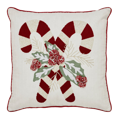 Isolated view of the holiday accent pillow featuring crossed candy canes, red bow, and green holly embroidery.