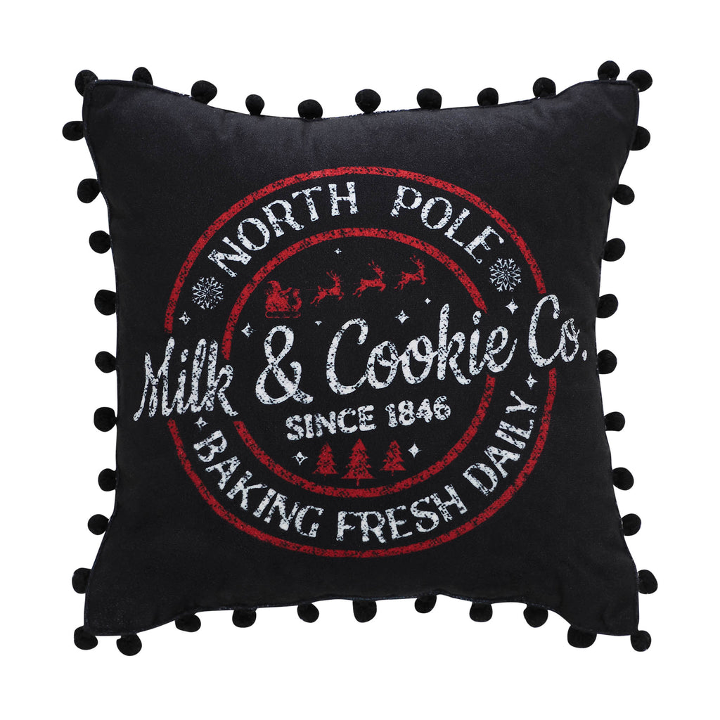 Front view of square black decorative pillow with white vintage holiday stamp and ruffled edges.
