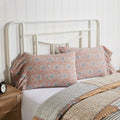 Set of two dusty rose country pillowcases featuring a navy and creme floral pattern with an elegant 8-inch ruffle trim.
