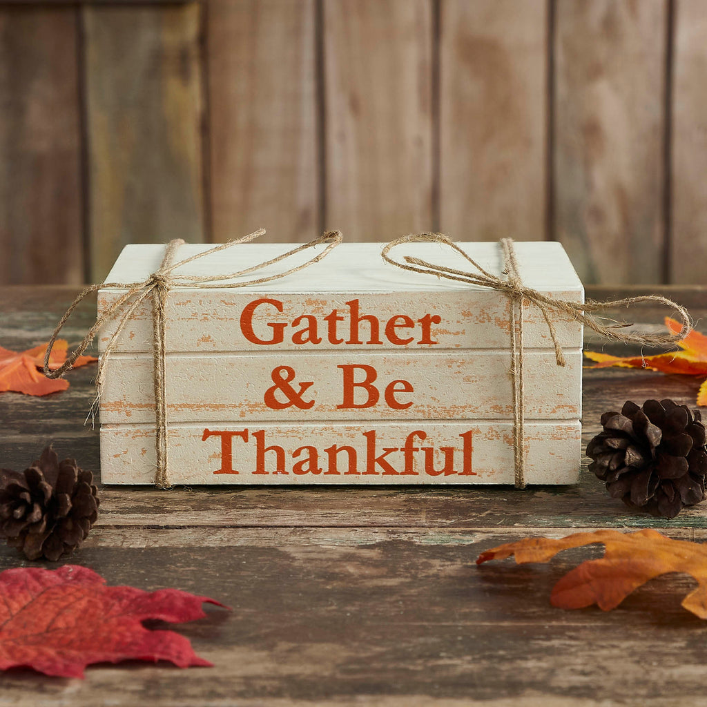Rustic faux wooden book stack with the phrase "Gather & Be Thankful," distressed white finish, and jute twine measuring 6 x 4 x 2.5 inches.