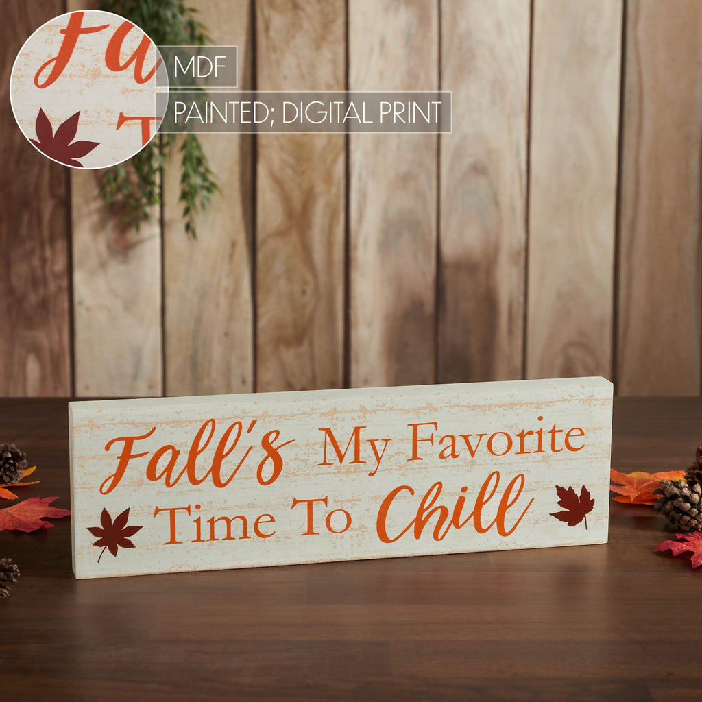 Autumn wooden sign styled as fall home decor against a rustic wall background.