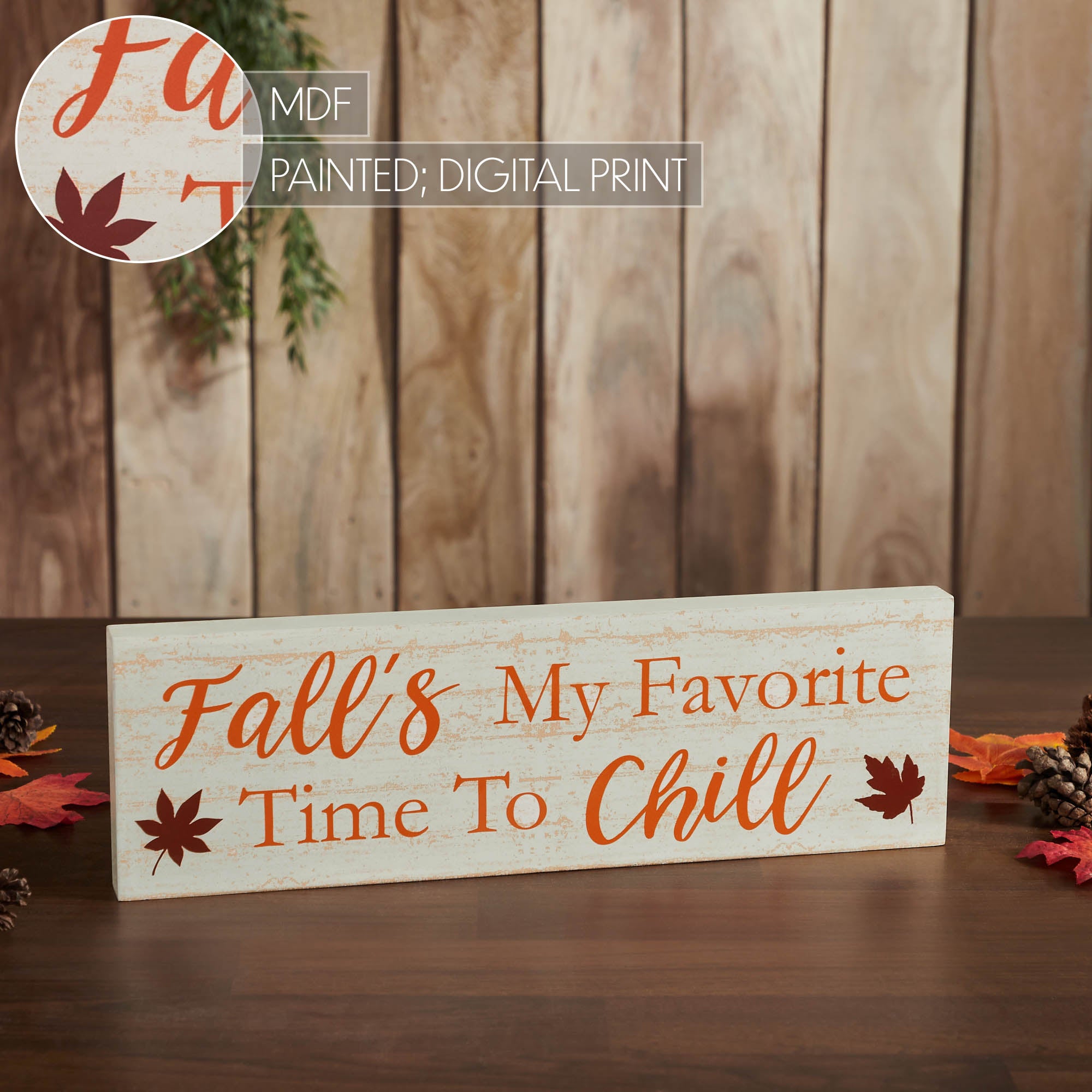 Autumn wooden sign styled as fall home decor against a rustic wall background.