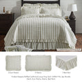 Finders Keepers Ruffled Grey Stripe 6pc Quilt Bundle on a bed with layered shams and ruffled bed skirt