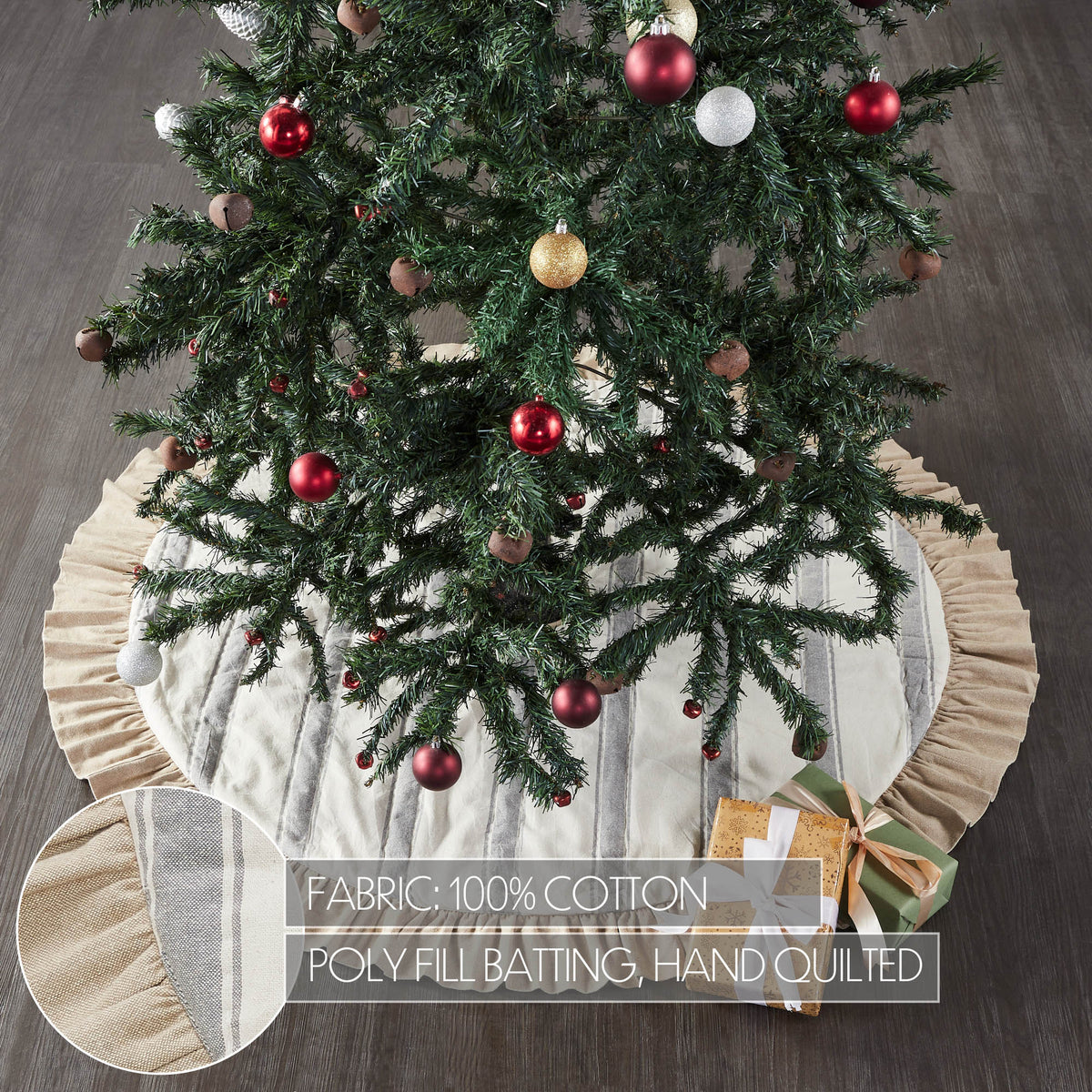 Striped tree skirt with ruffle trim placed beneath a fully decorated Christmas tree.