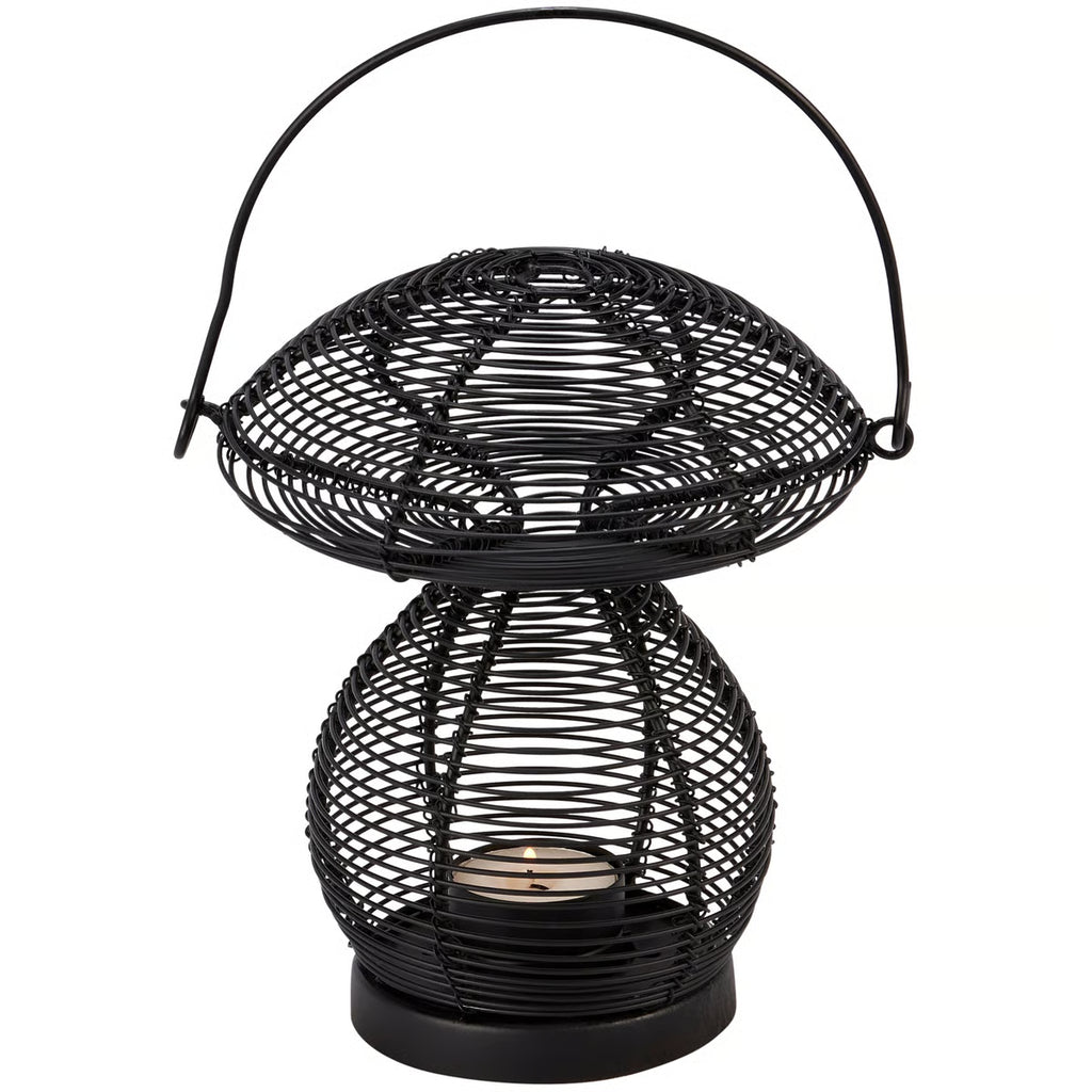 Black wire-mesh mushroom-shaped candle holder lantern with a top handle, holding a small lit candle inside against a white background.