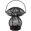 Black wire-mesh mushroom-shaped candle holder lantern with a top handle, holding a small lit candle inside against a white background.