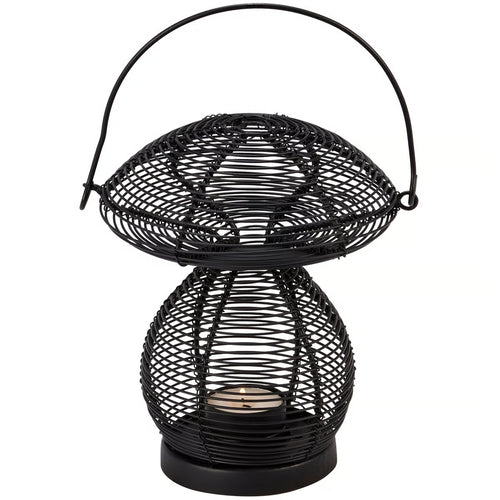 Black wire-mesh mushroom-shaped candle holder lantern with a top handle, holding a small lit candle inside against a white background.