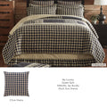 My Country Queen Quilt set styled on a bed with black and tan gingham pattern and matching shams.