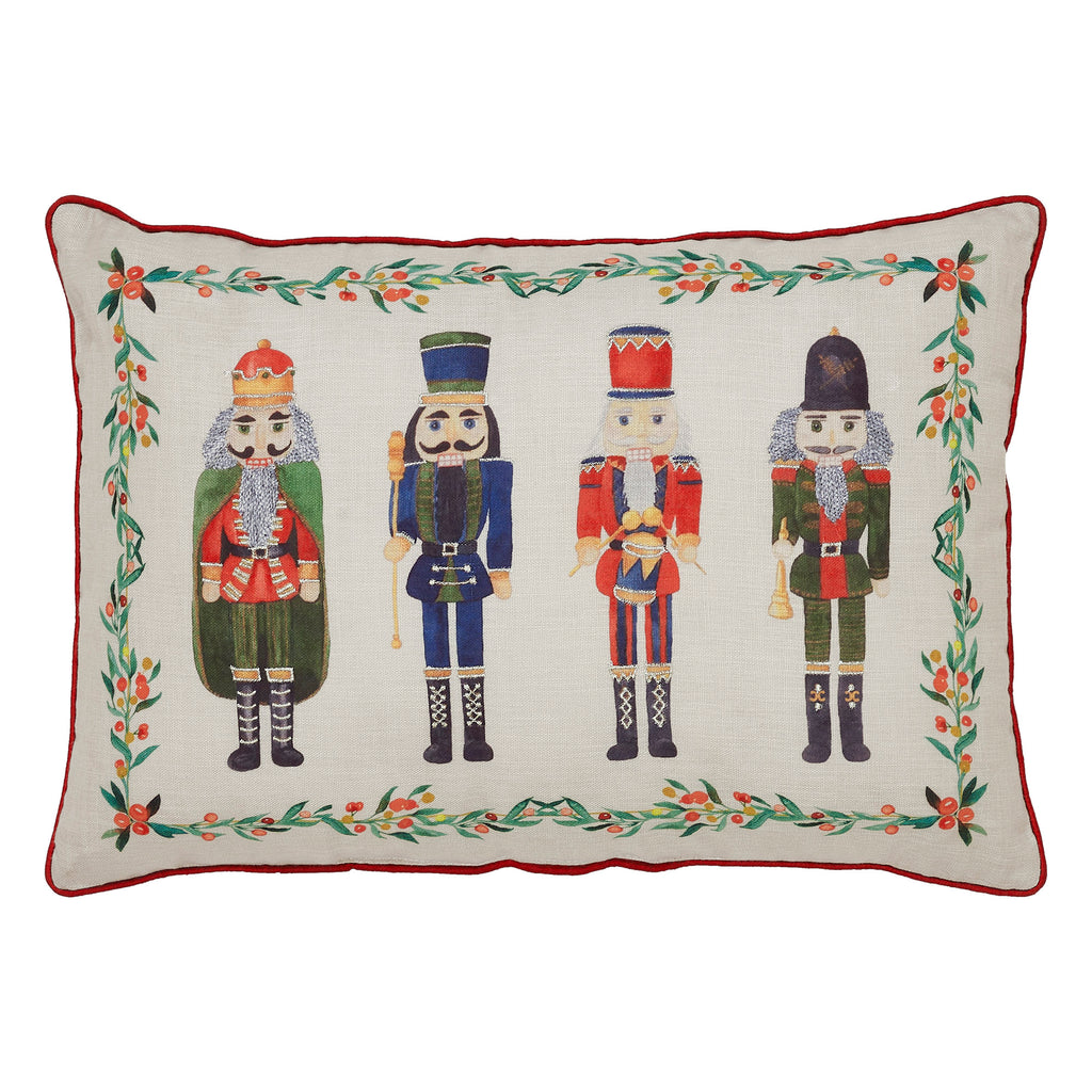 Front view of the lumbar pillow showcasing the line of detailed nutcracker soldiers embroidered on neutral fabric.