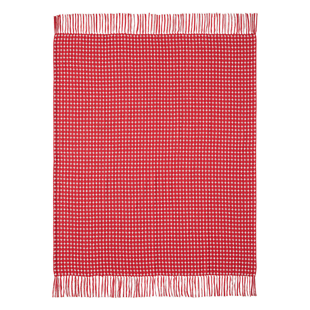 Flat lay product view showing the red and white woven plaid pattern and fringe trim edge of the throw blanket.