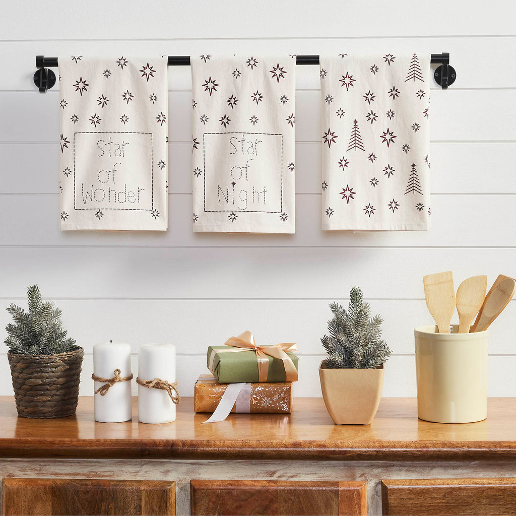 Rustic Christmas tree throw pillow styled on a living room couch alongside festive holiday decor.